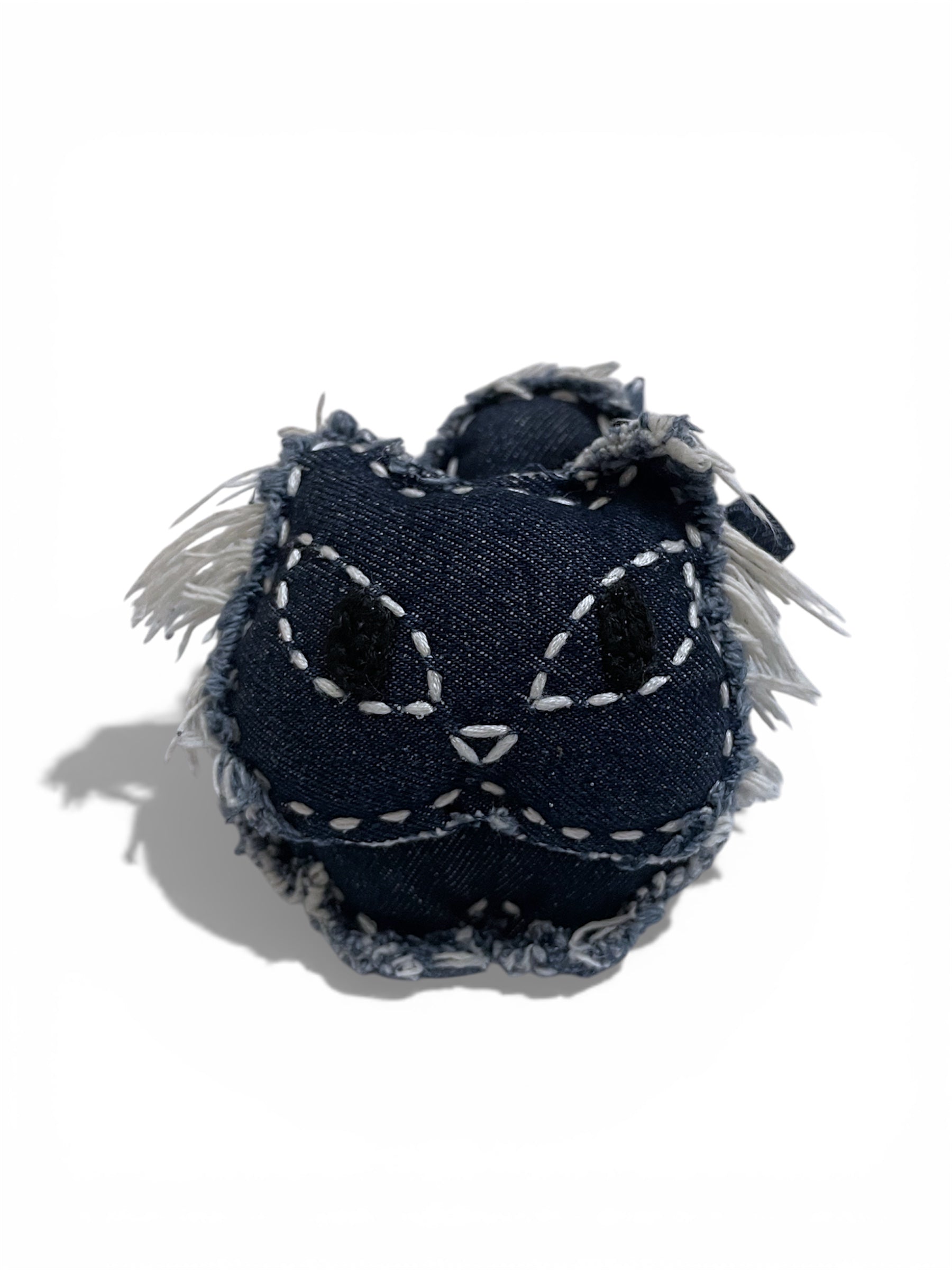 denim charm. denim bag charm. denim accessory. denim on denim. bag accessory. bag charm. keychain. handmade. artisanal. pendant. cat. denim cat. punk fashion. quiet luxury. aesthetic. minimalism. vintage retro. edgy. rugged. weathered. rustic. distressed.  fray edge. whimsical luxury. stud. shines most when paired with leather details. denim lover. animal lover. fashion addicted. disney character. nostalgia. bold personality. birthday gift. special occasion gift. luxury brand. high-end fashion.
