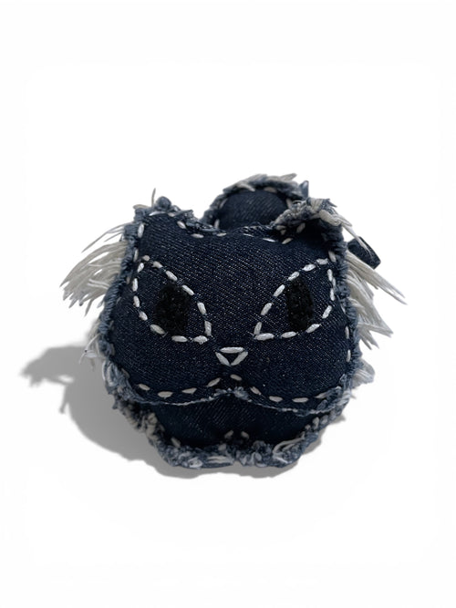 denim charm. denim bag charm. denim accessory. denim on denim. bag accessory. bag charm. keychain. handmade. artisanal. pendant. cat. denim cat. punk fashion. quiet luxury. aesthetic. minimalism. vintage retro. edgy. rugged. weathered. rustic. distressed.  fray edge. whimsical luxury. stud. shines most when paired with leather details. denim lover. animal lover. fashion addicted. disney character. nostalgia. bold personality. birthday gift. special occasion gift. luxury brand. high-end fashion.
